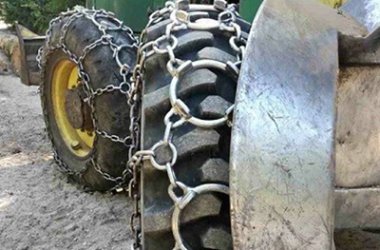 Forestry Tire working in field with chain